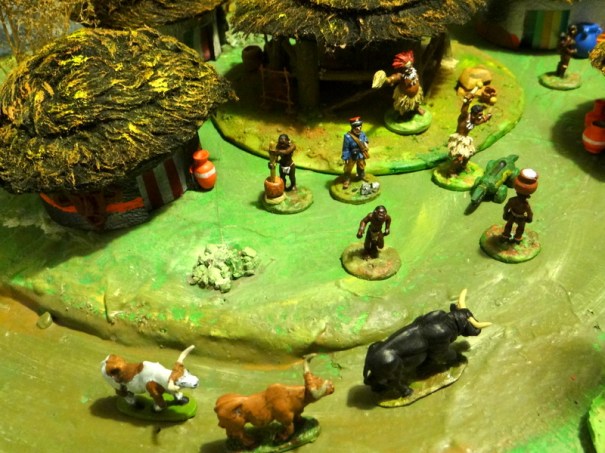 On voit le Docteur Raymond, en bleu, au centre du village.